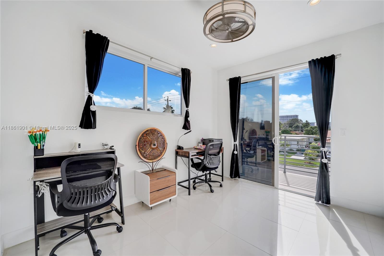 2943 Southwest 23rd Street Miami, FL 33145 - Photo 10 of 21 a view of a dining room with furniture a chandelier and wooden floor