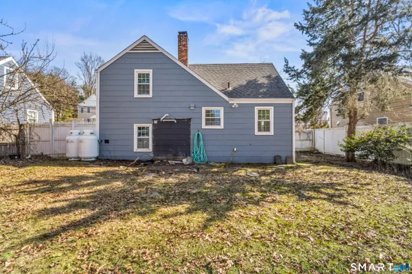a view of a house with a yard and garage