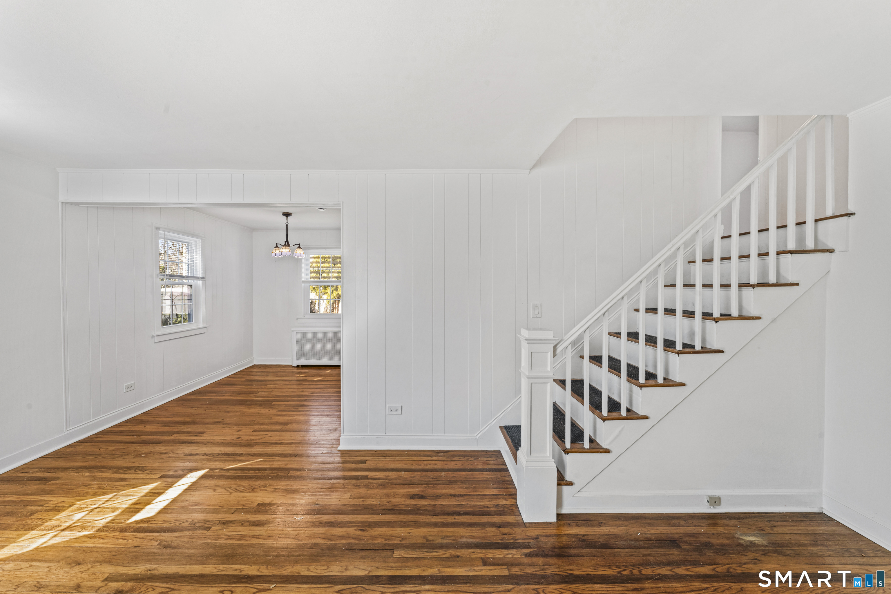 167 Hollow Tree Ridge Road Darien, CT 06820 - Photo 16 of 38 a view of entryway and hall with wooden floor