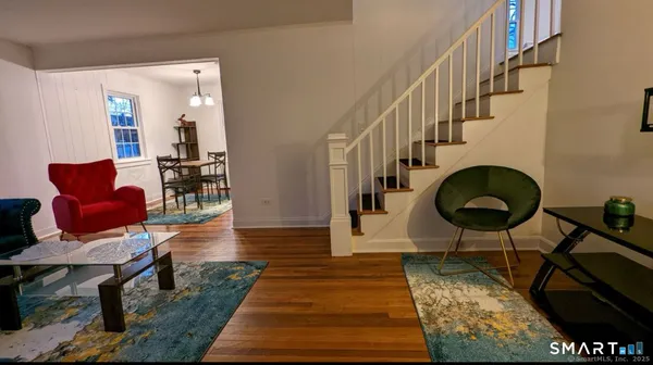 a living room with furniture and a rug