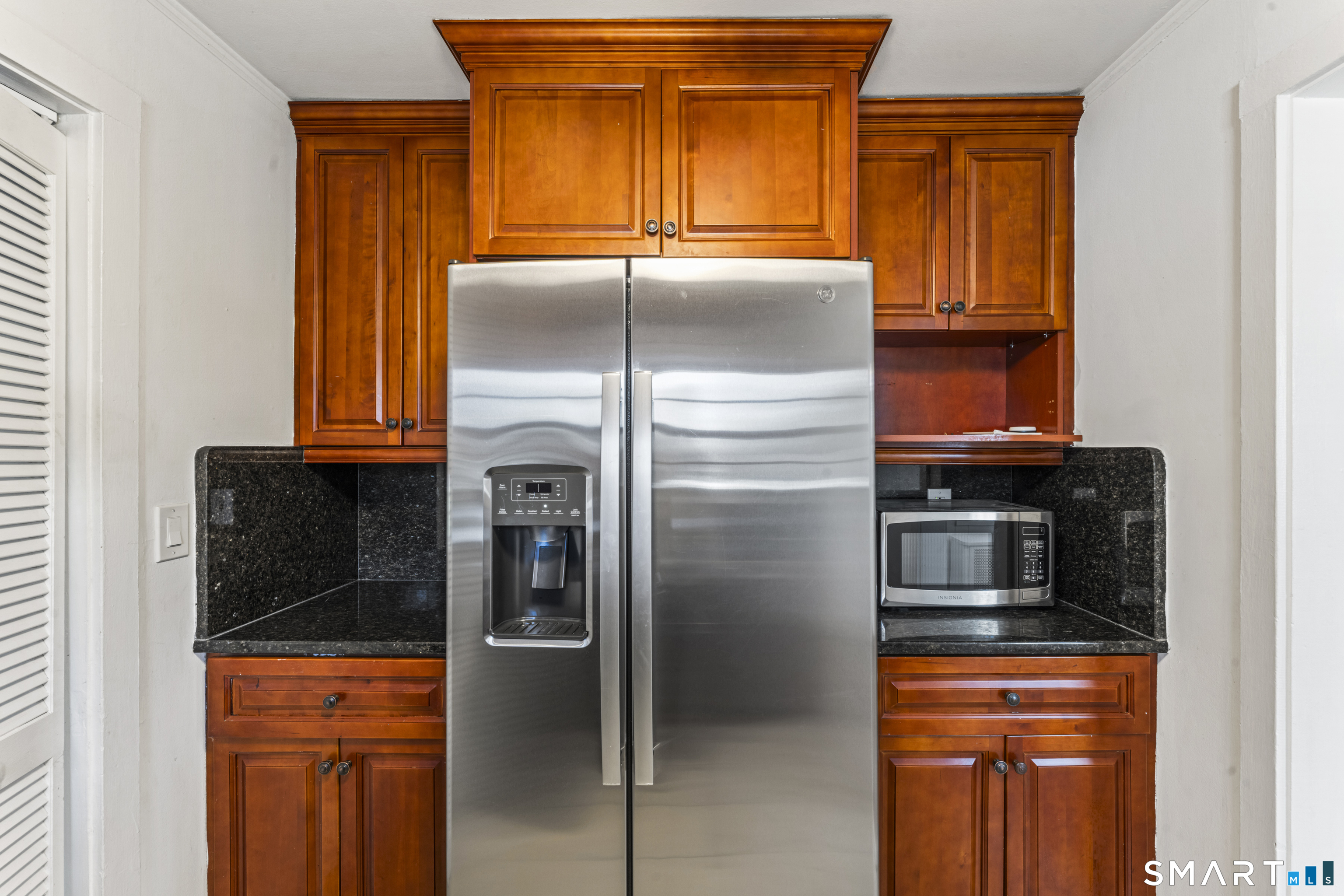 167 Hollow Tree Ridge Road Darien, CT 06820 - Photo 22 of 38 a kitchen with stainless steel appliances granite countertop a refrigerator and a stove
