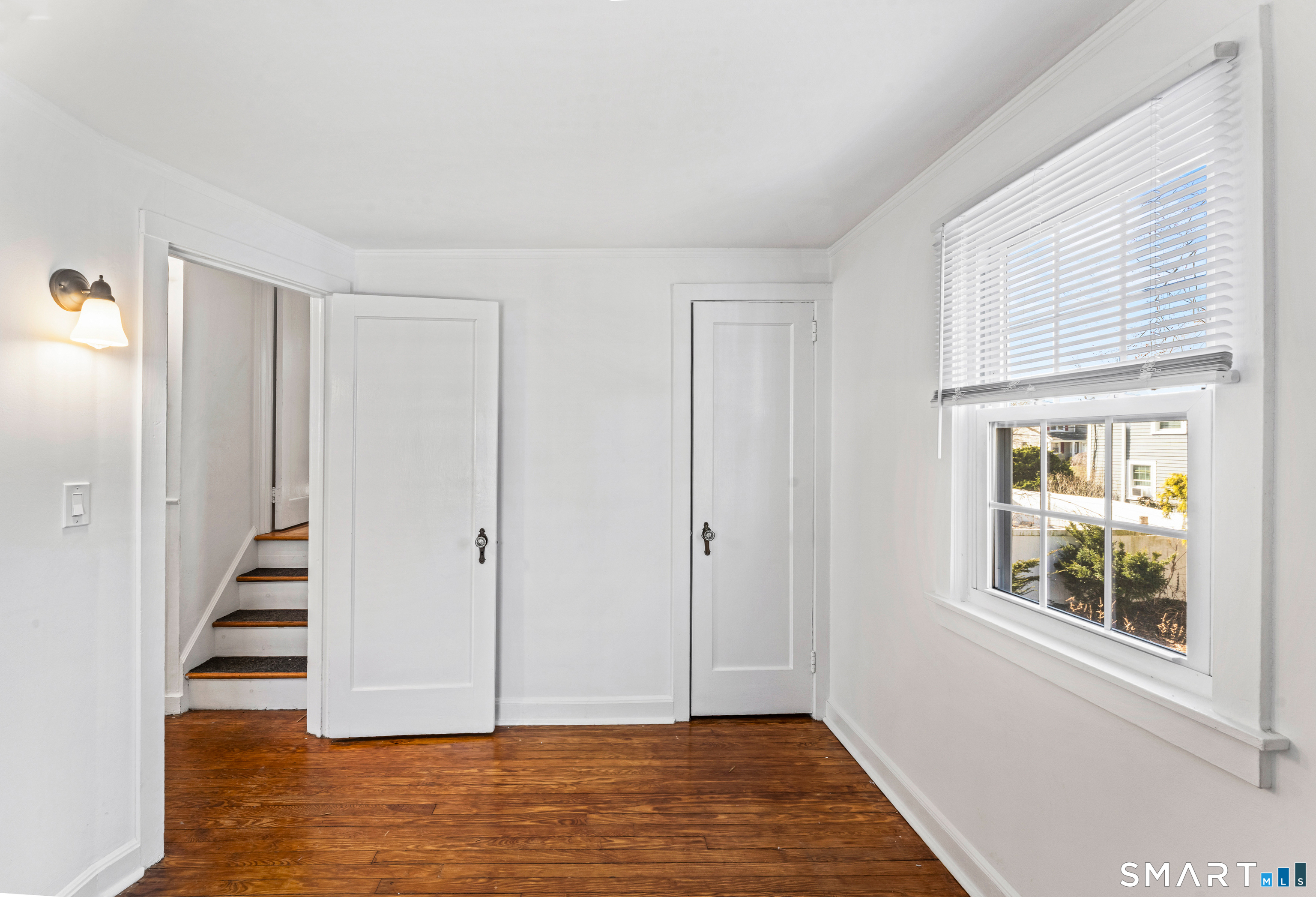 167 Hollow Tree Ridge Road Darien, CT 06820 - Photo 25 of 38 a view of an entryway with wooden floor and staircase