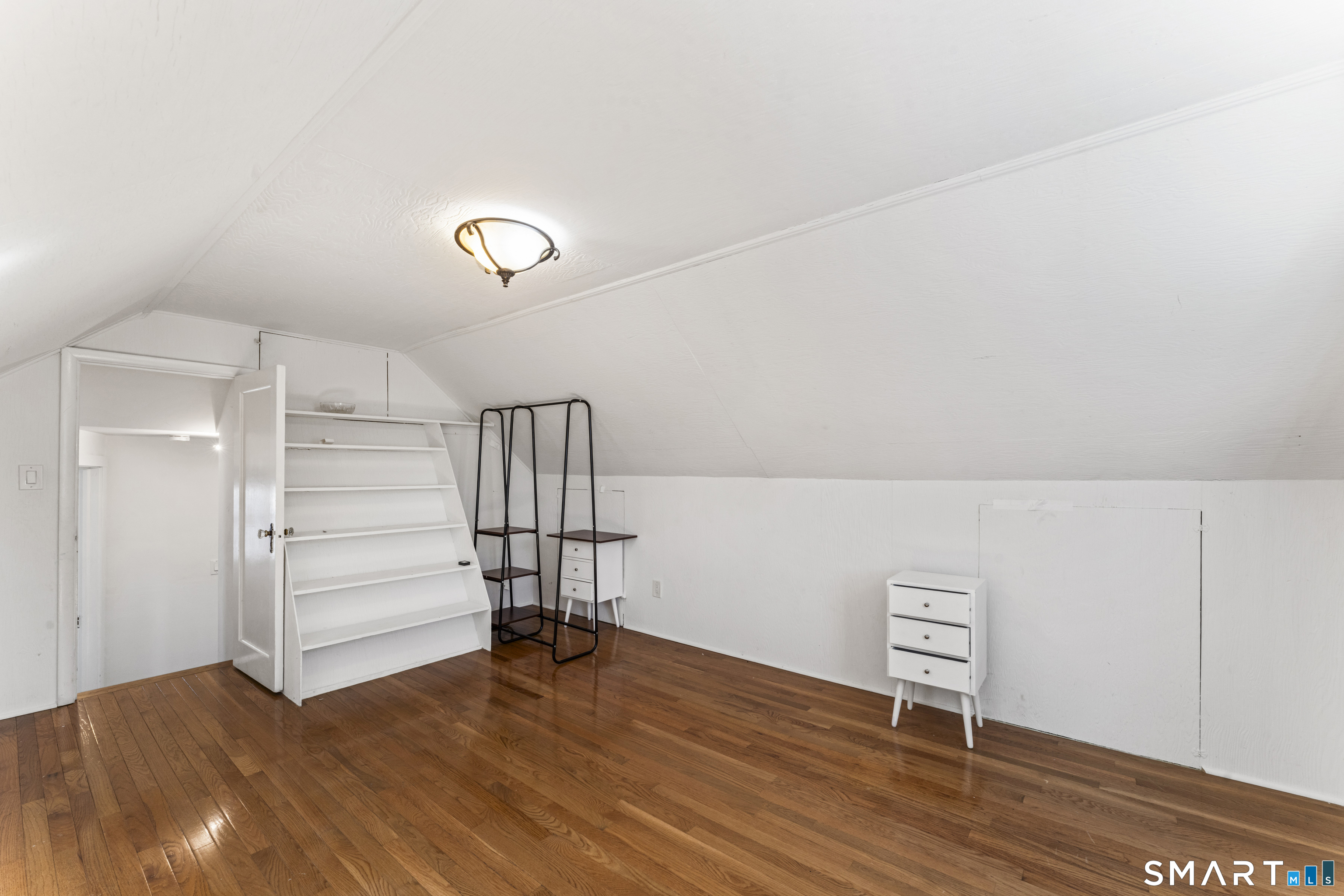 167 Hollow Tree Ridge Road Darien, CT 06820 - Photo 31 of 38 a view of a room with wooden floor