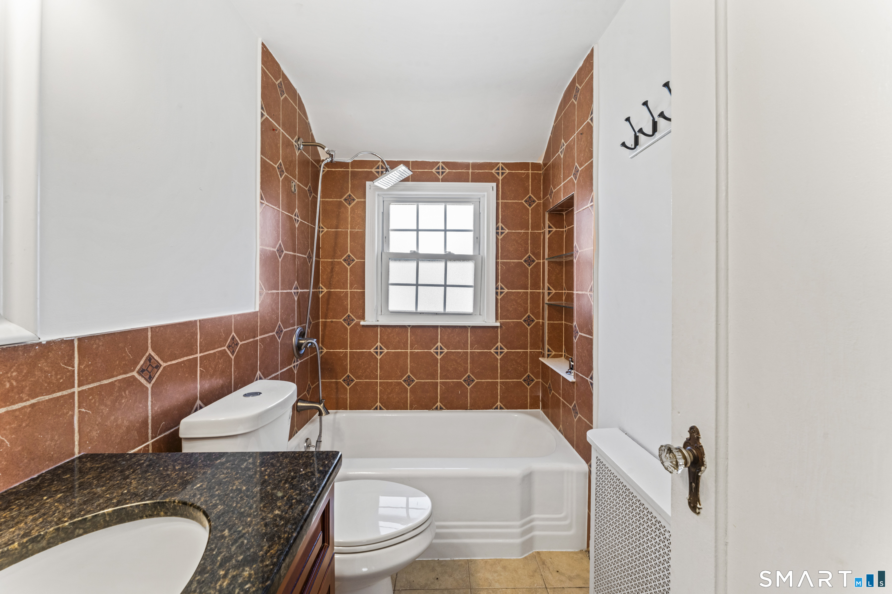 167 Hollow Tree Ridge Road Darien, CT 06820 - Photo 33 of 38 a bathroom with a granite countertop sink toilet and shower