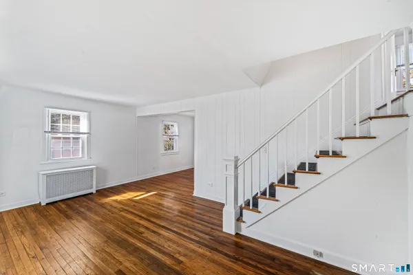 a view of entryway with wooden floor