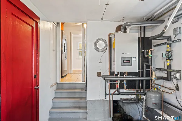a view of entryway and hall with wooden floor