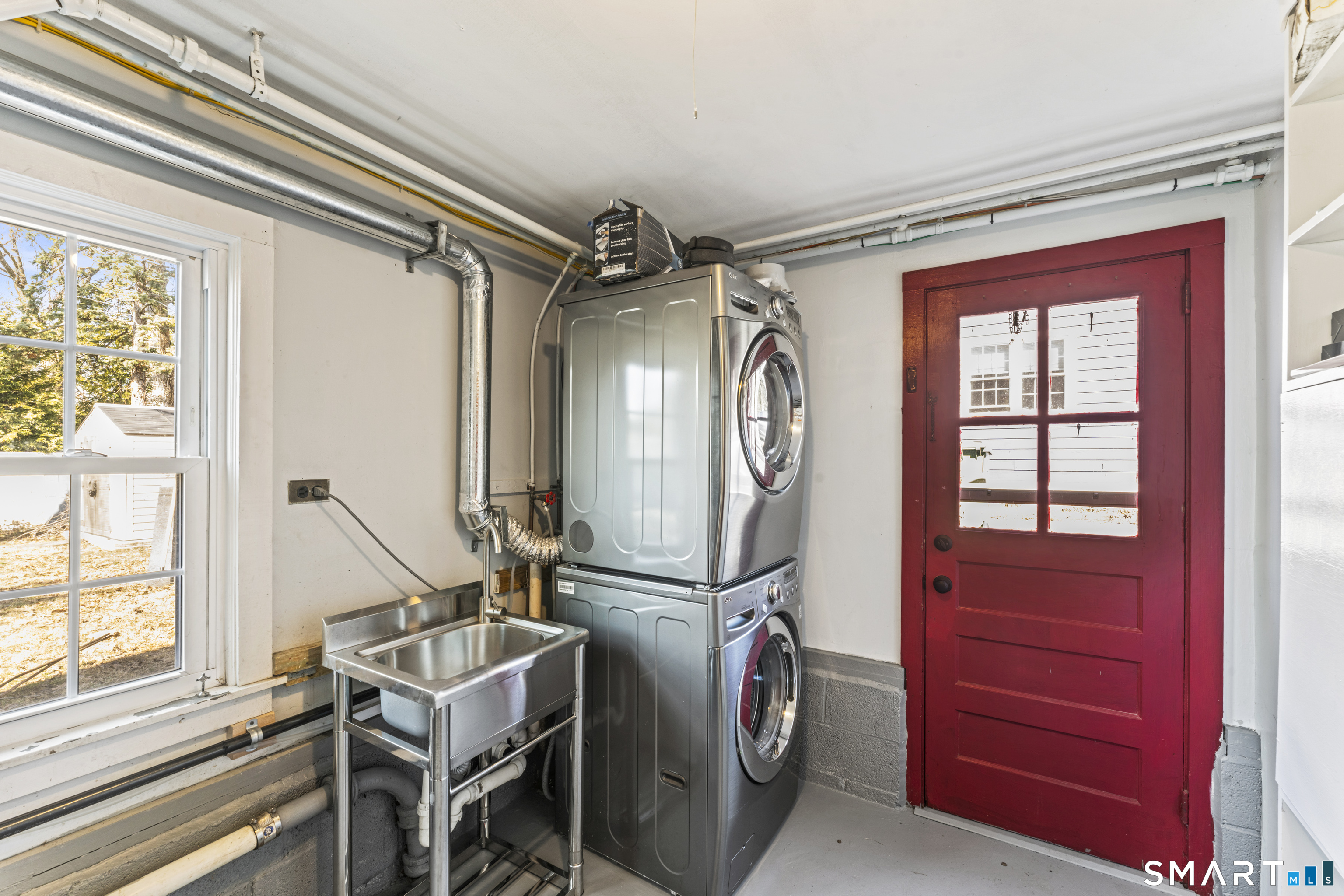 167 Hollow Tree Ridge Road Darien, CT 06820 - Photo 37 of 38 a view of a livingroom with furniture and windows