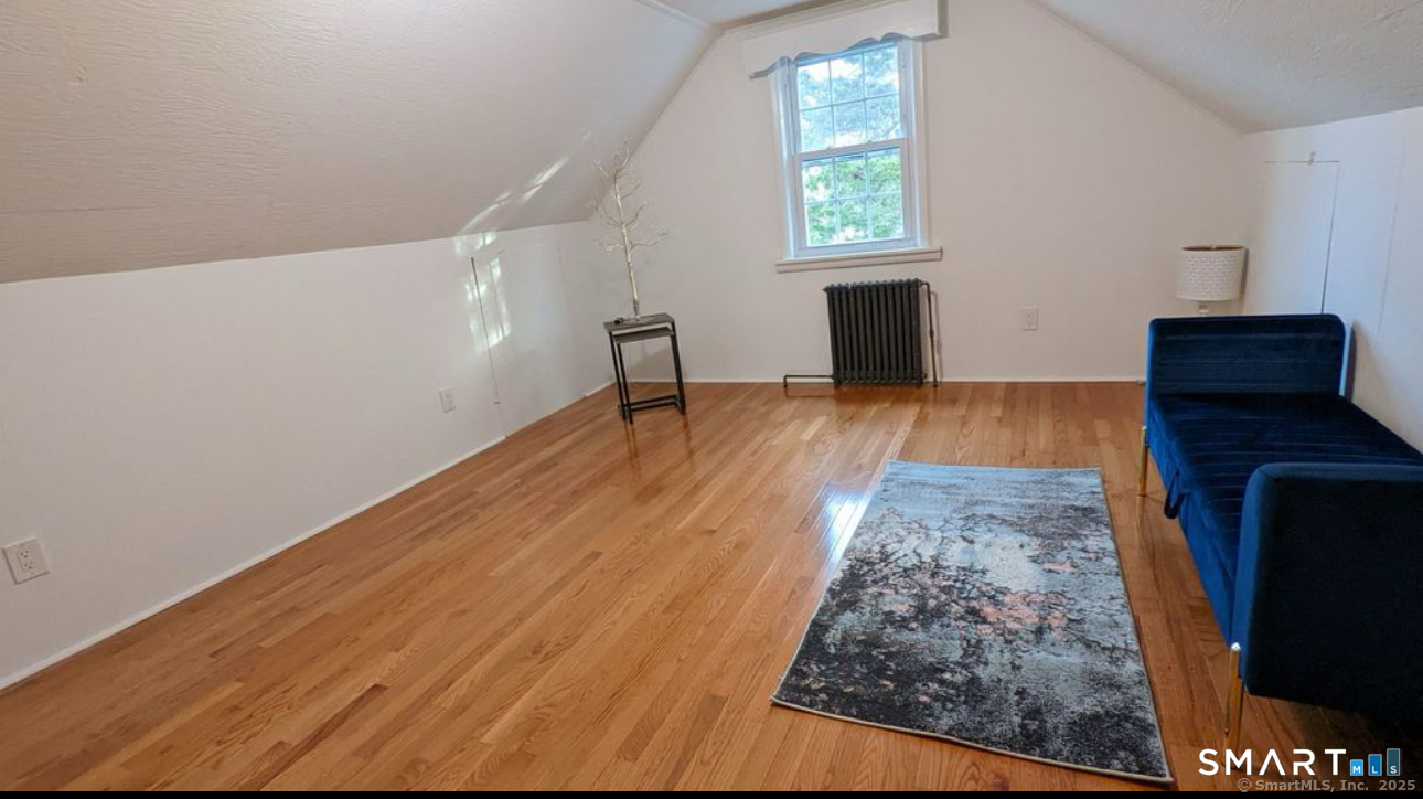167 Hollow Tree Ridge Road Darien, CT 06820 - Photo 7 of 38 wooden floor in an empty room with a window