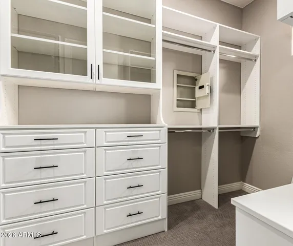 a kitchen with a refrigerator and cabinets