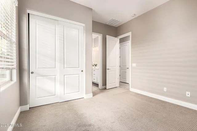 a bathroom with a double vanity sink and mirror