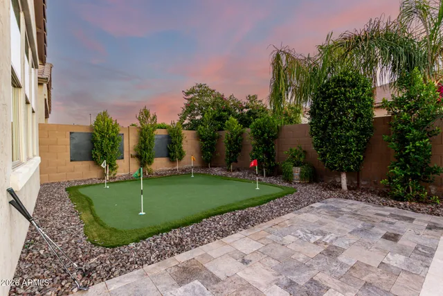 a house view with swimming pool and porch
