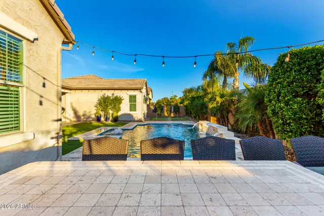 a view of a yard and palm trees