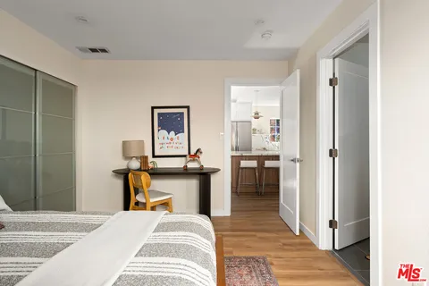 a bedroom with a bed and a view of bathroom