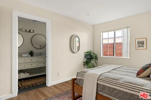 a bedroom with bed and a window