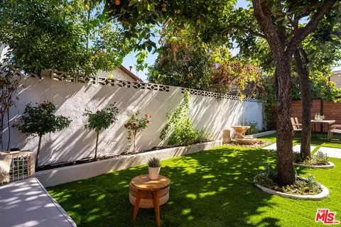 a view of a backyard of the house