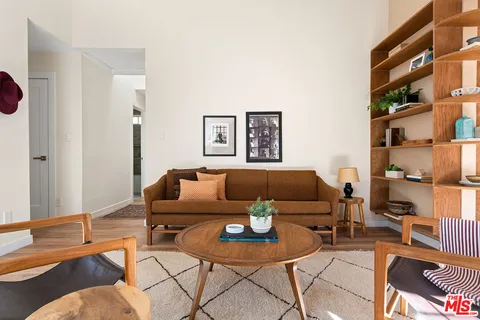a living room with furniture and a rug