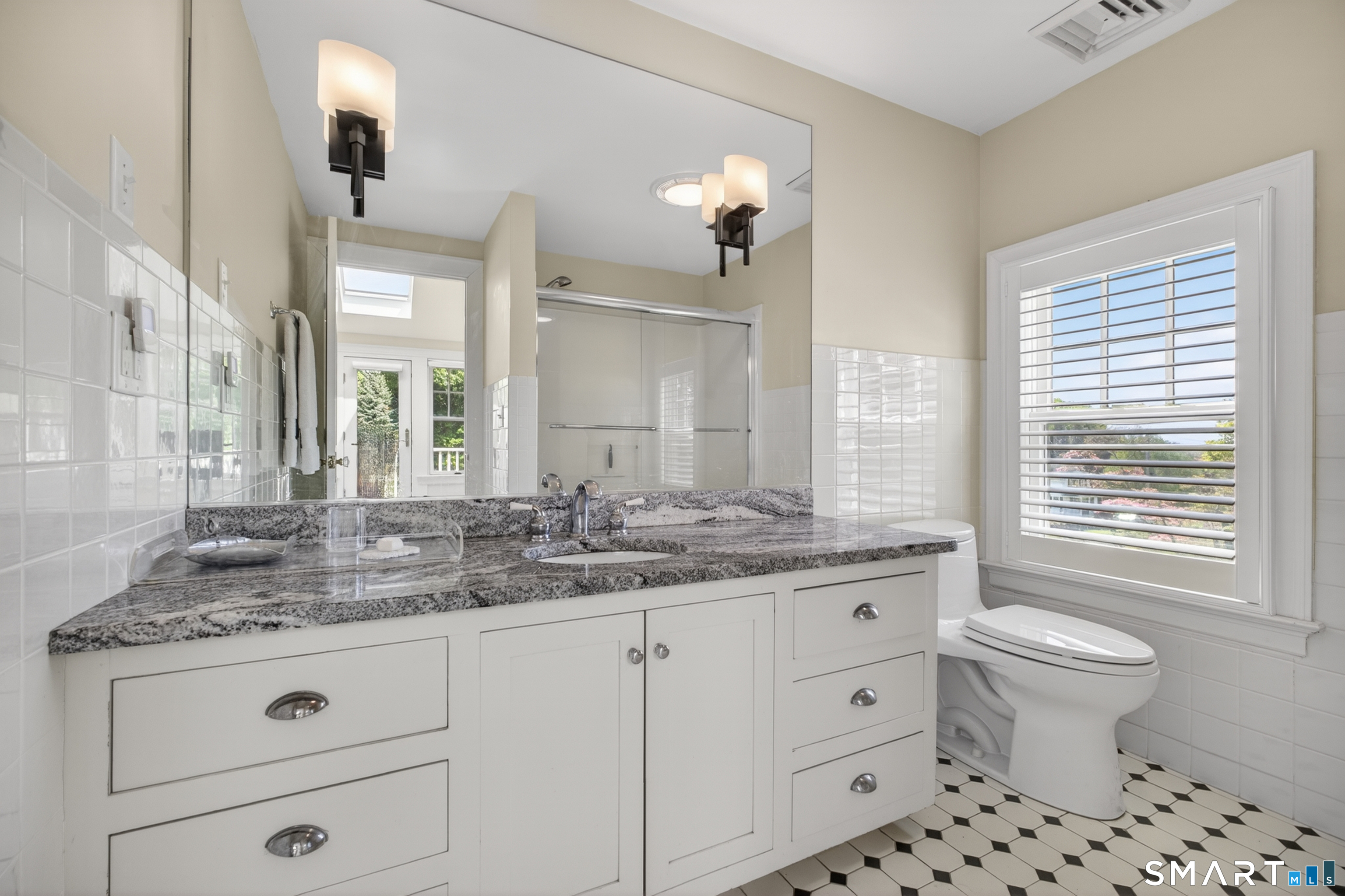 10 Prospect Street Groton, CT 06355 - Photo 31 of 40 a bathroom with a granite countertop toilet sink and mirror