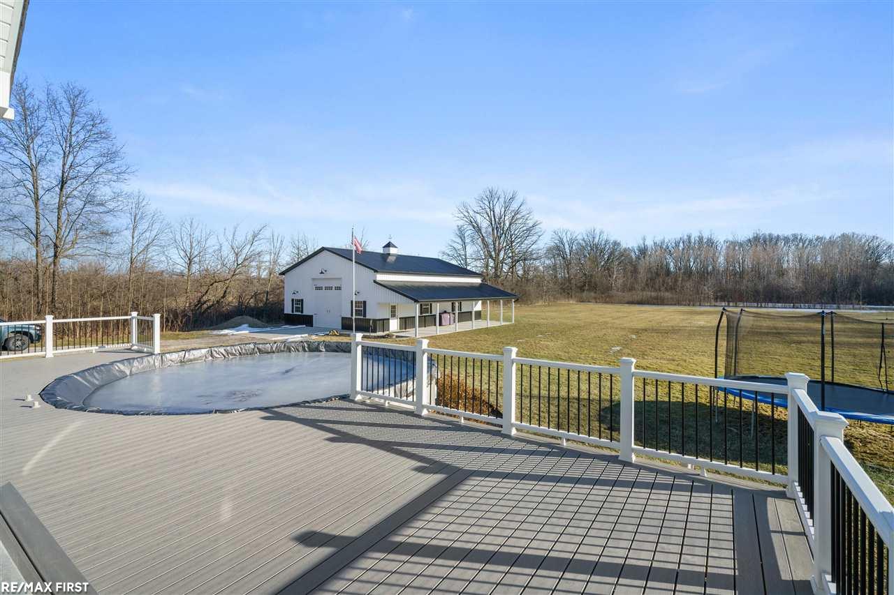 15888 29 Mile Road Ray, MI 48096 - Photo 51 of 63 Trex Rear Decking at Pool