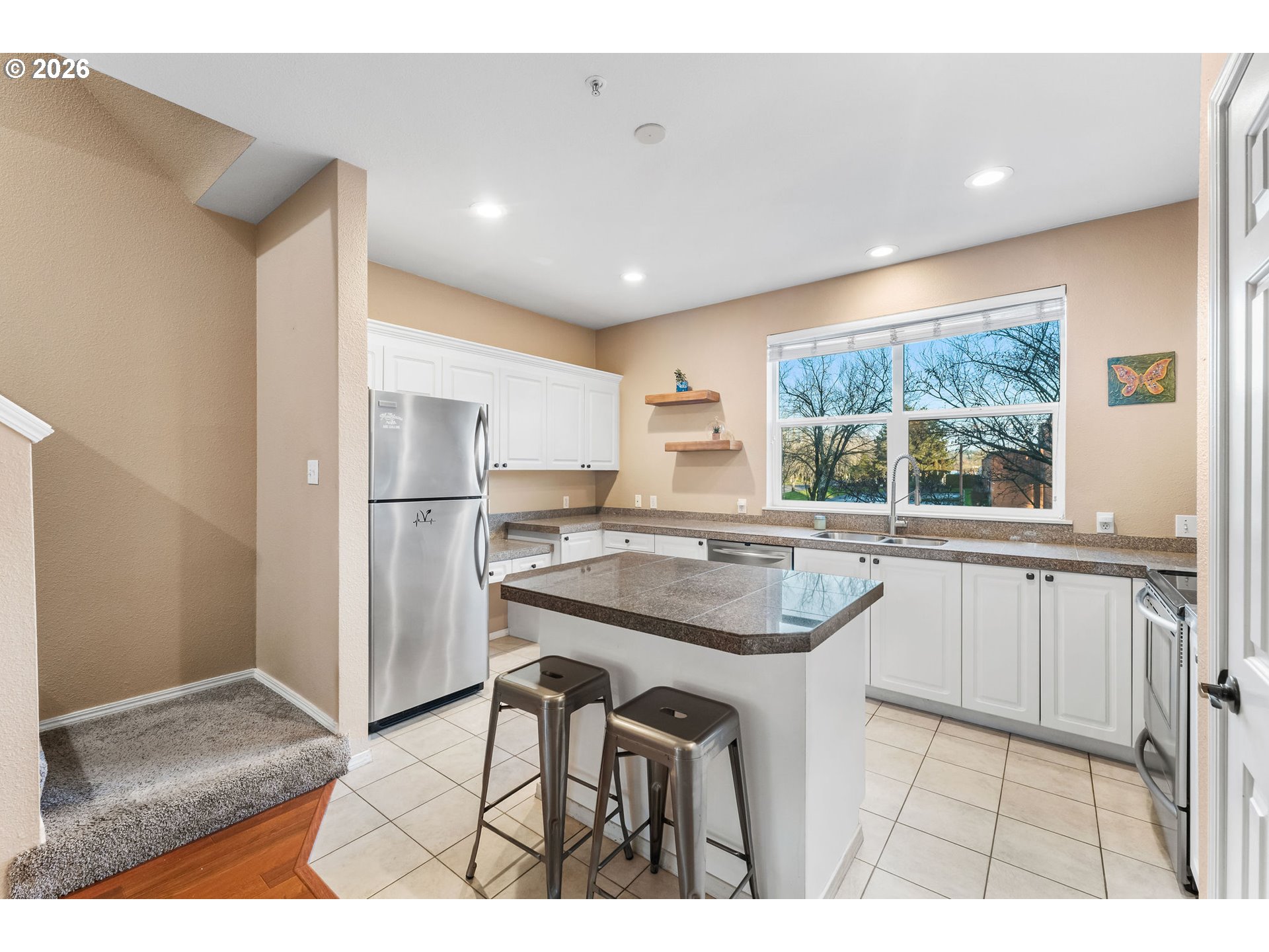 1816 Southeast Cutter Lane Vancouver, WA 98661 - Photo 17 of 43 a kitchen with kitchen island a sink stove and refrigerator