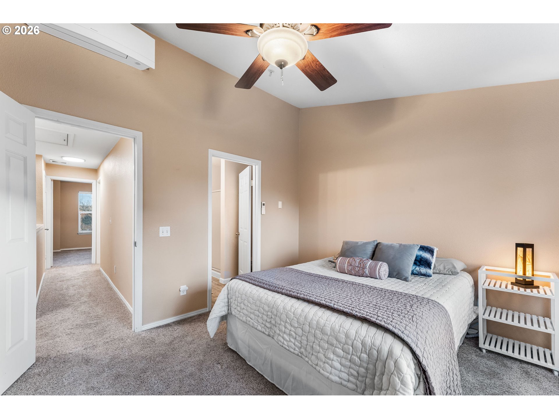 1816 Southeast Cutter Lane Vancouver, WA 98661 - Photo 23 of 43 a bedroom with a bed and a chandelier