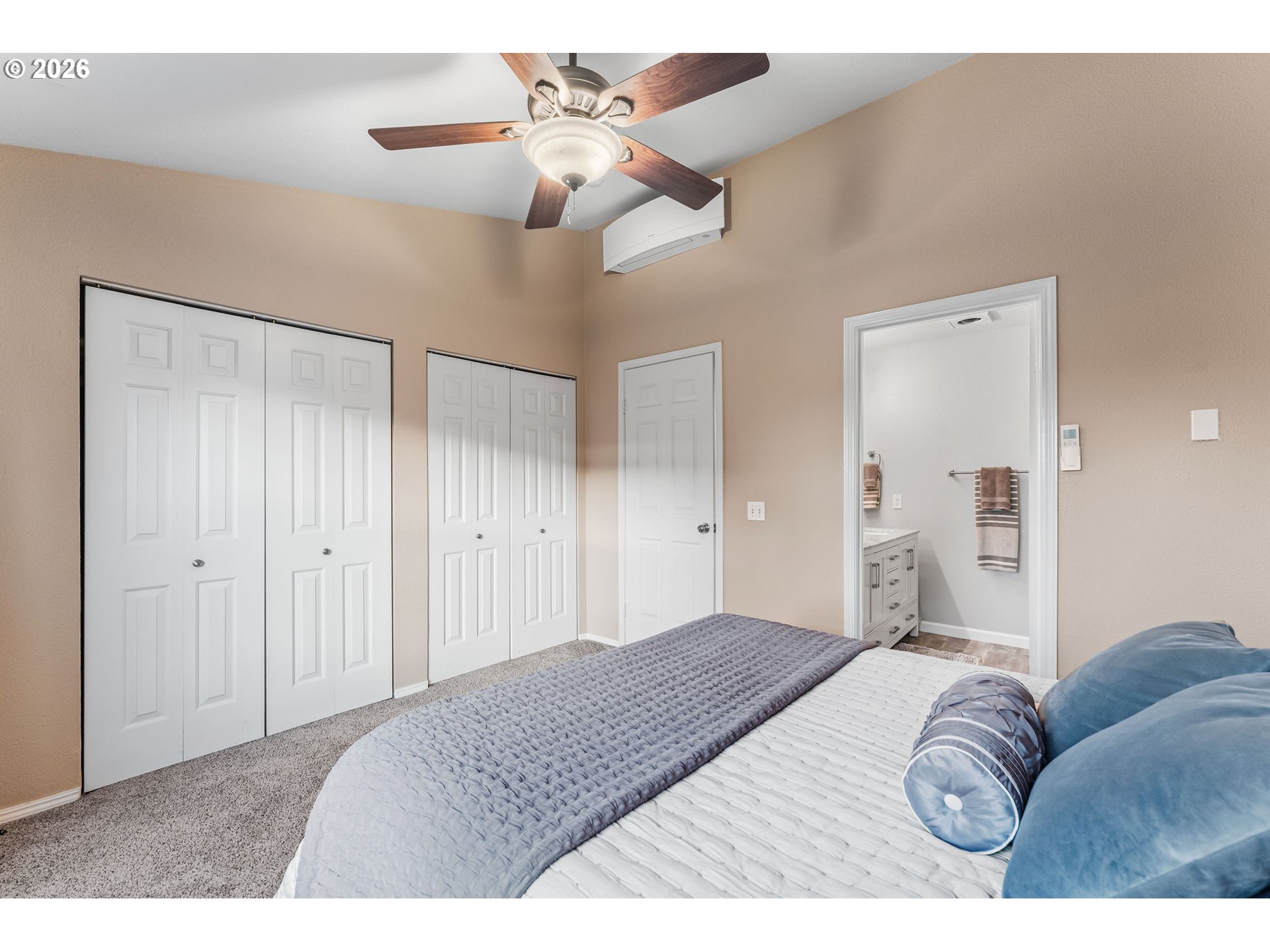 1816 Southeast Cutter Lane Vancouver, WA 98661 - Photo 24 of 43 a bedroom with a bed and a chandelier