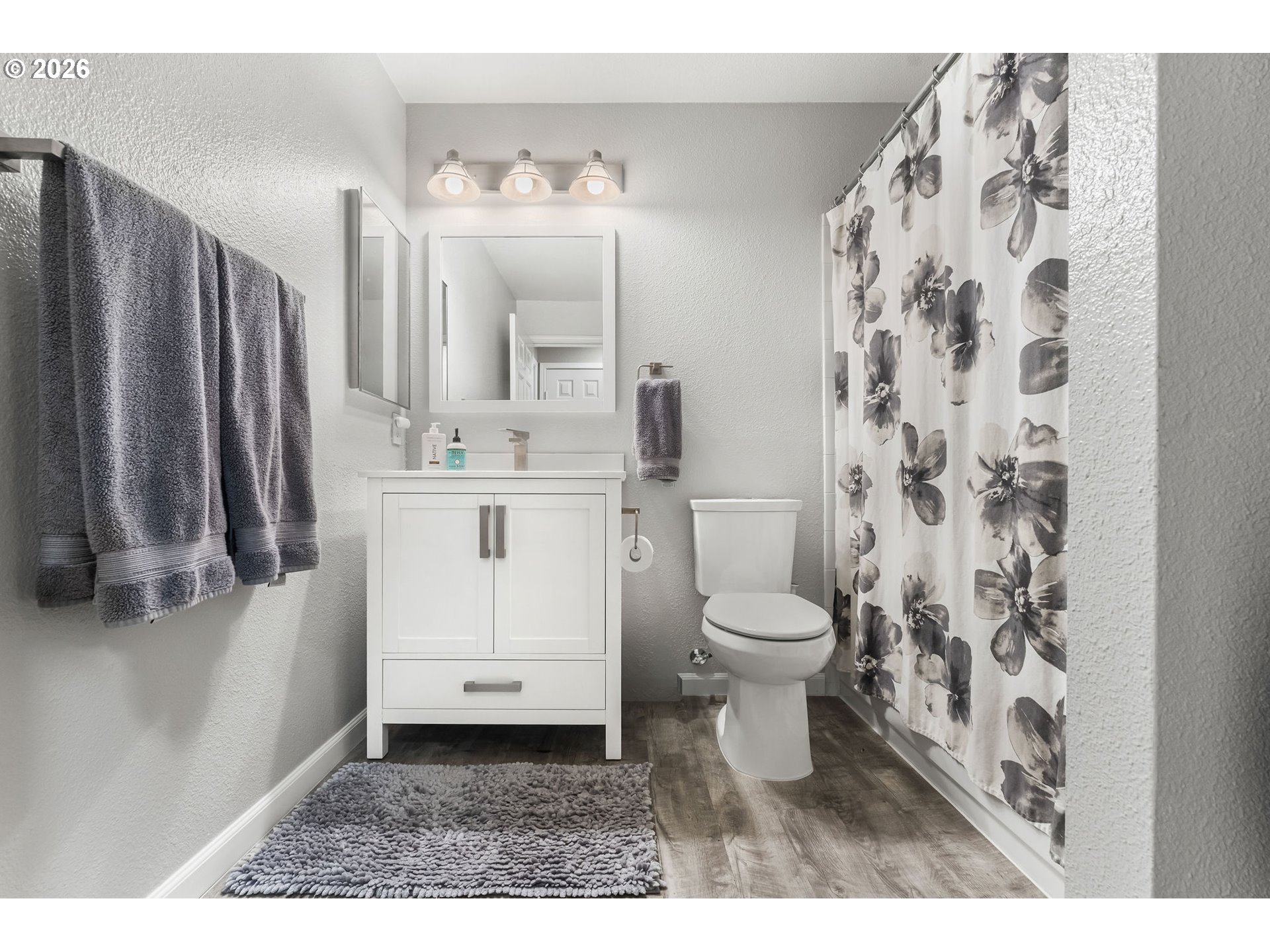 1816 Southeast Cutter Lane Vancouver, WA 98661 - Photo 31 of 43 a bathroom with a sink a toilet and a mirror