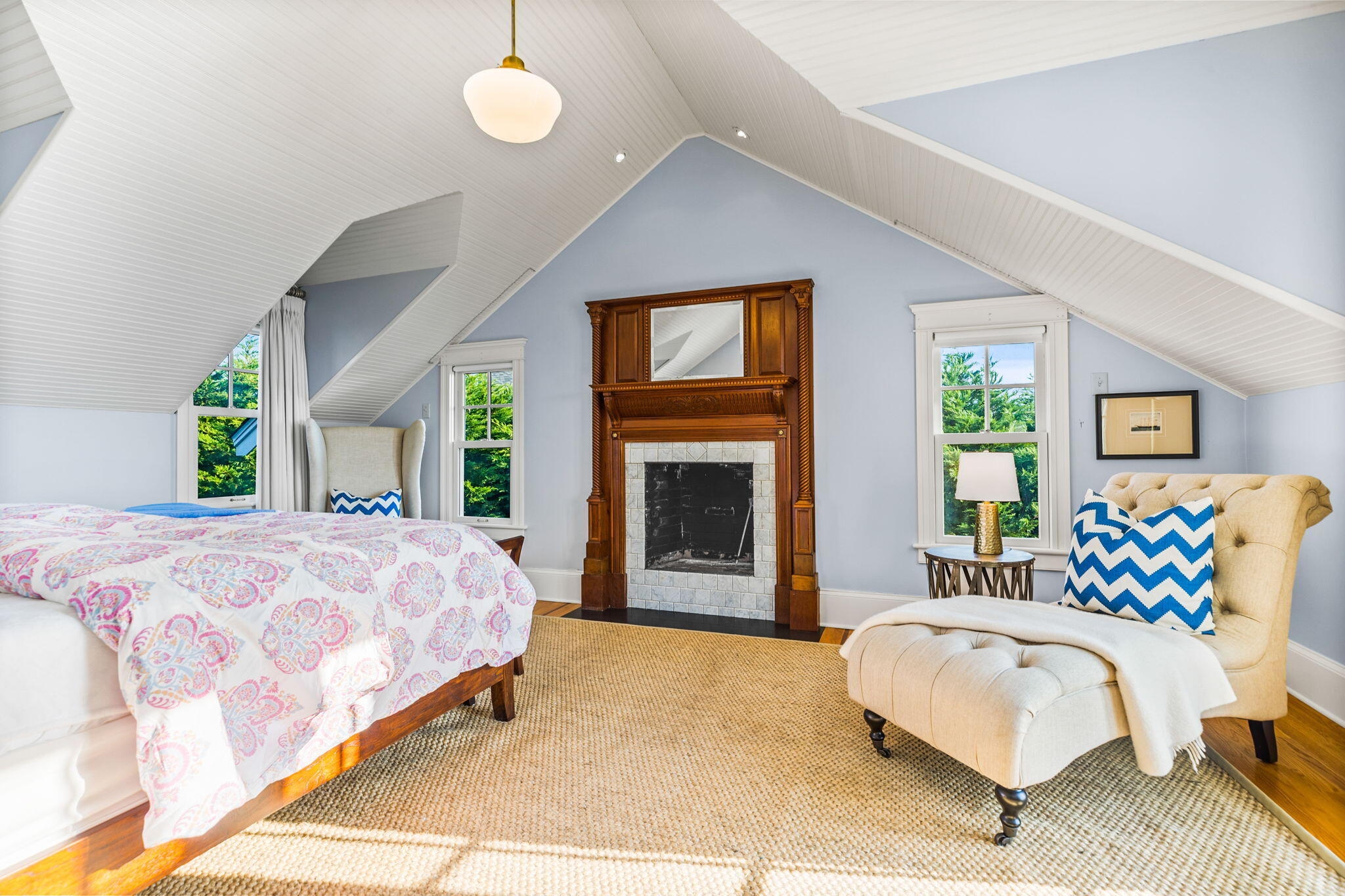 20 Bay Shore Road Hyannis, MA 02601 - Photo 28 of 42 a bedroom with a bed lamp and a fireplace
