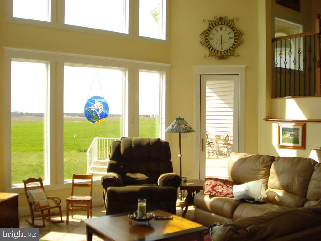 7840 Queponco Road Newark, MD 21841 - Photo 14 of 43 a living room with furniture and a large window