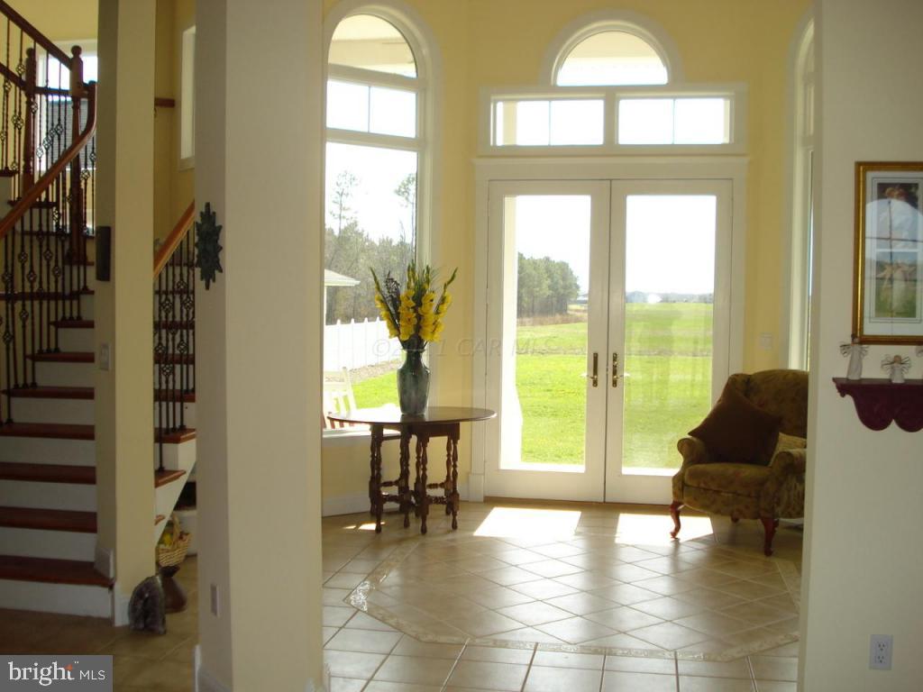 7840 Queponco Road Newark, MD 21841 - Photo 5 of 43 a living room with furniture and a large window