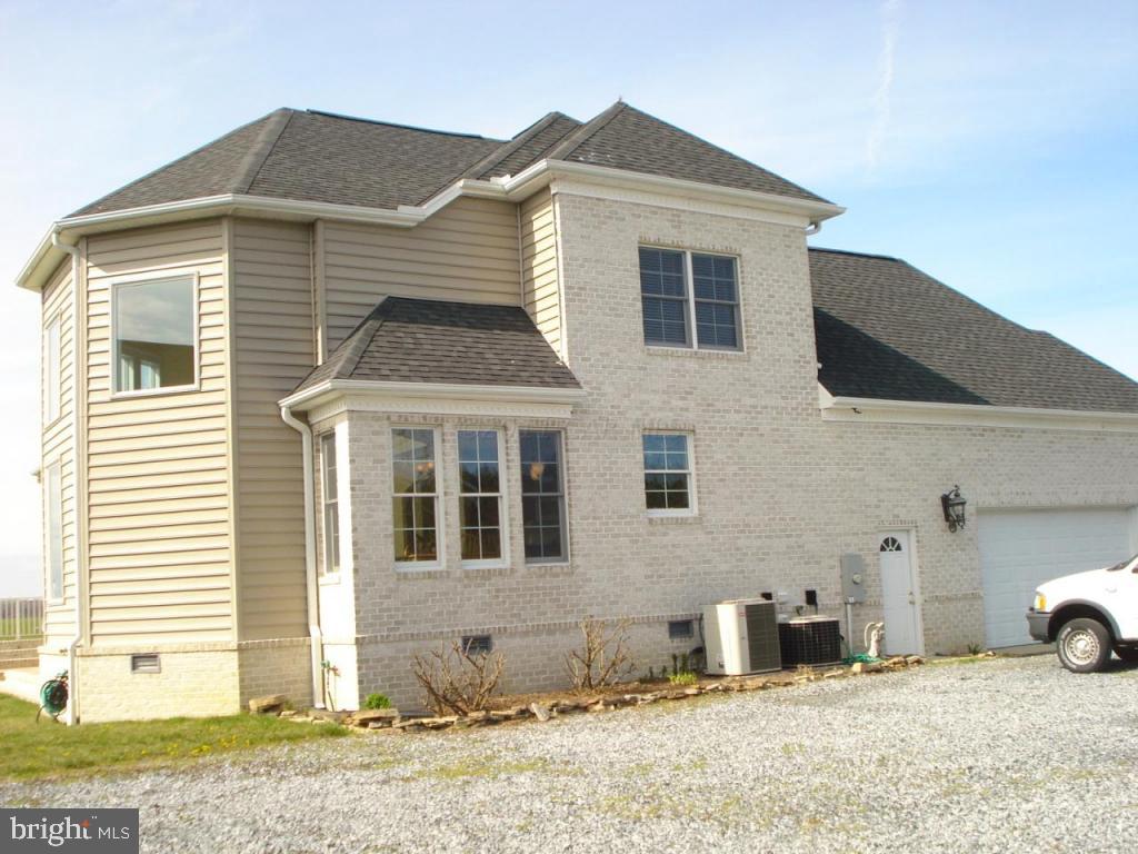 7840 Queponco Road Newark, MD 21841 - Photo 42 of 43 a front view of a house with a yard