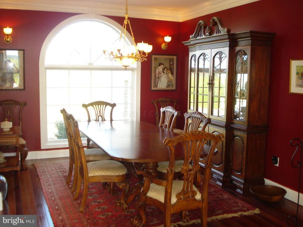 7840 Queponco Road Newark, MD 21841 - Photo 8 of 43 a view of a dining room with furniture window and wooden floor