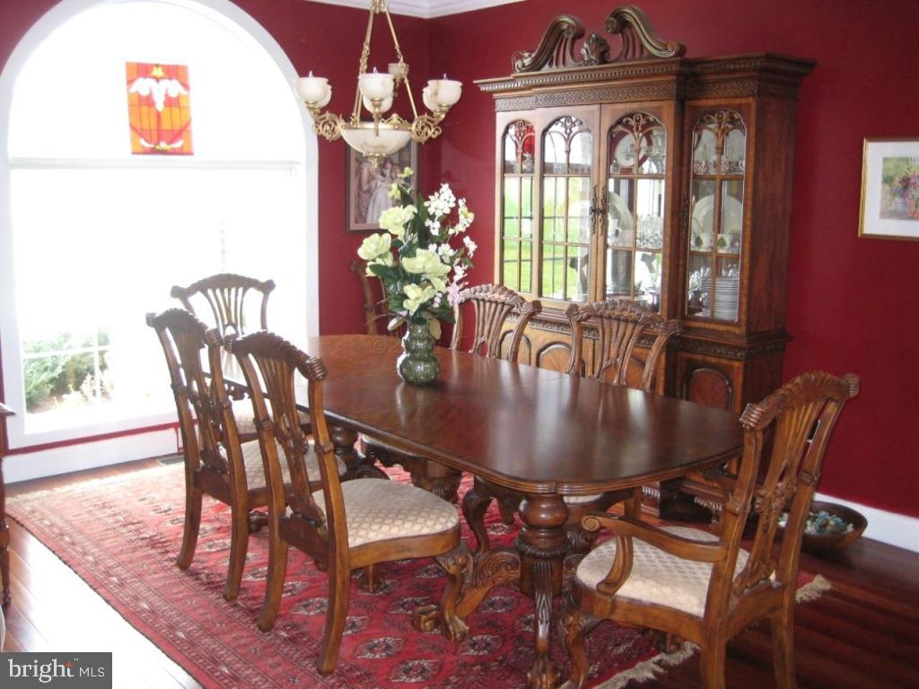 7840 Queponco Road Newark, MD 21841 - Photo 9 of 43 a view of a dining room with furniture and chandelier