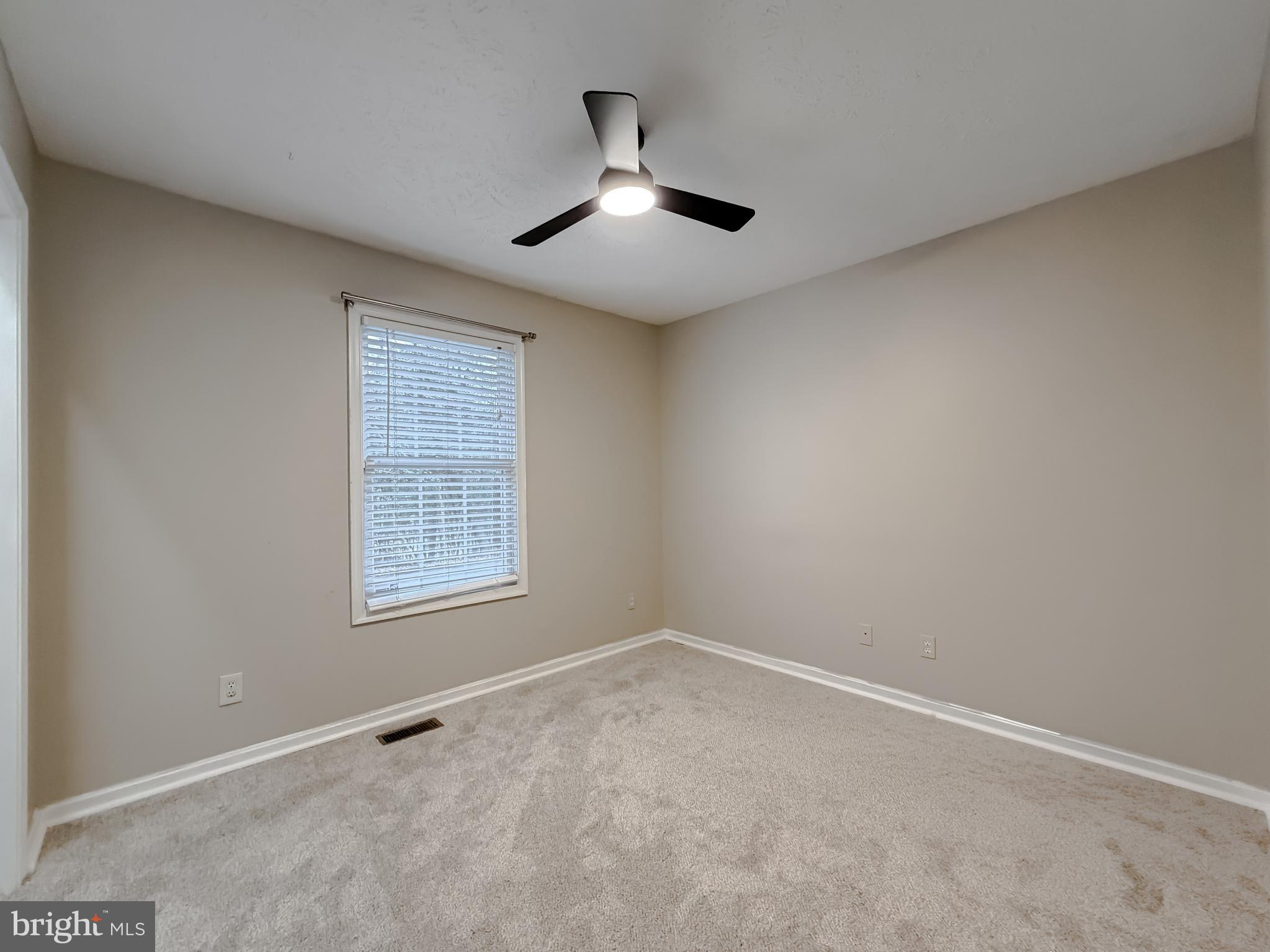 19830 Fall Court Great Mills, MD 20634 - Photo 29 of 47 an empty room with a window and a ceiling fan