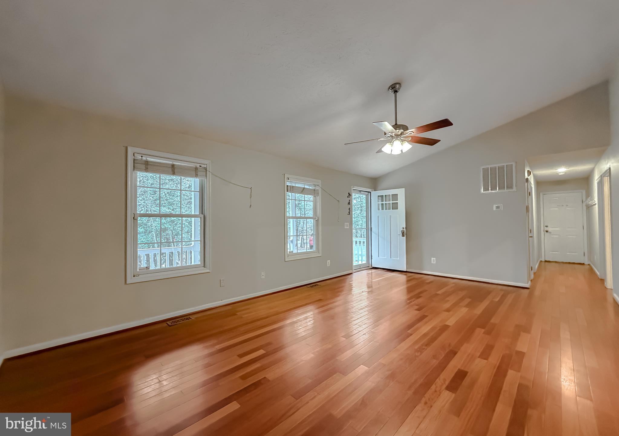 19830 Fall Court Great Mills, MD 20634 - Photo 3 of 47 a view of an empty room with wooden floor and a window