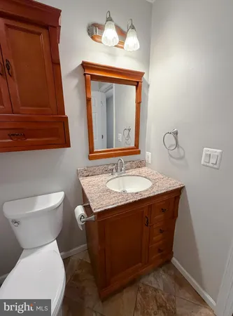 a bathroom with a toilet a sink and bathtub