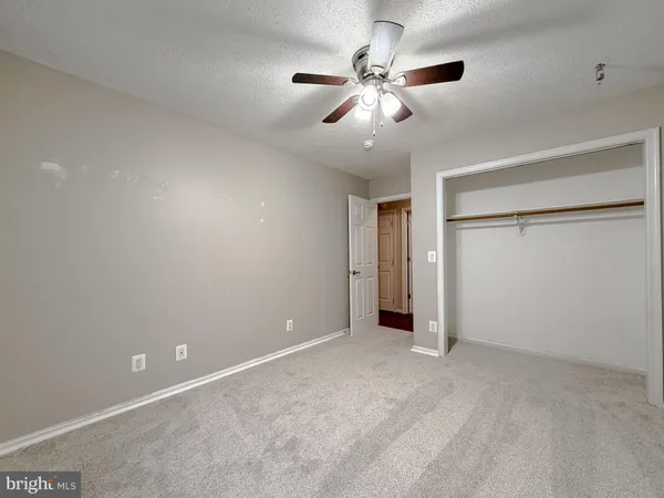 a view of an empty room with a cabinet