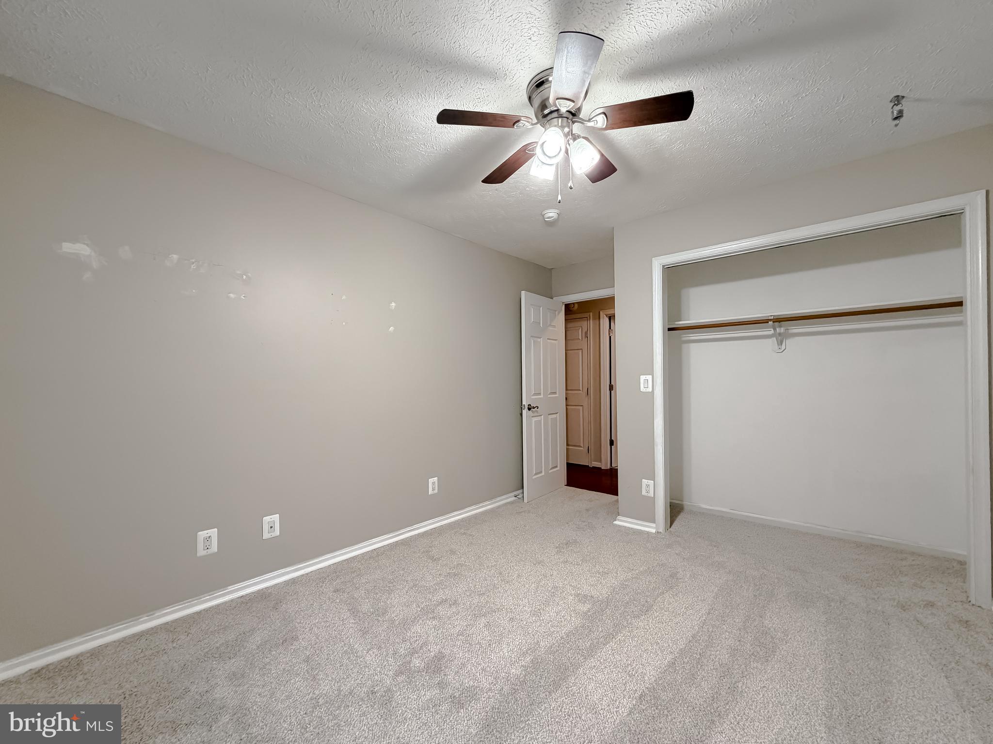 19830 Fall Court Great Mills, MD 20634 - Photo 37 of 47 an empty room with chandelier fan and closet area