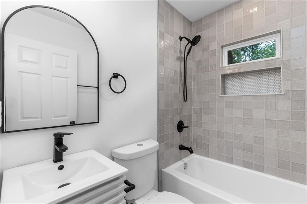 148 Bixby Terrace Southeast Atlanta, GA 30317 - Photo 9 of 19 a bathroom with a sink and a mirror
