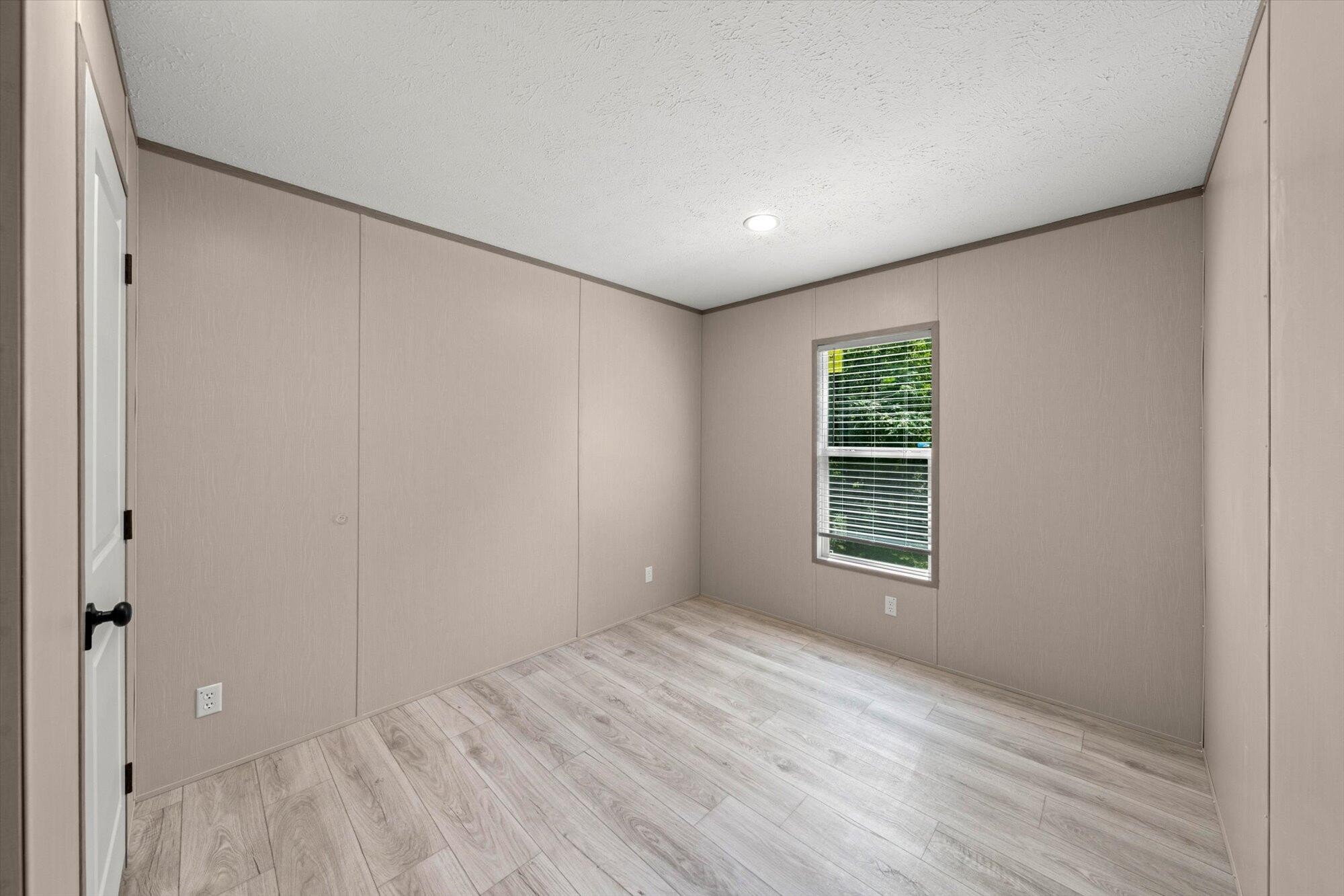 612 Caldwell Road Loudon, TN 37774 - Photo 13 of 16 a view of empty room with wooden floor and fan
