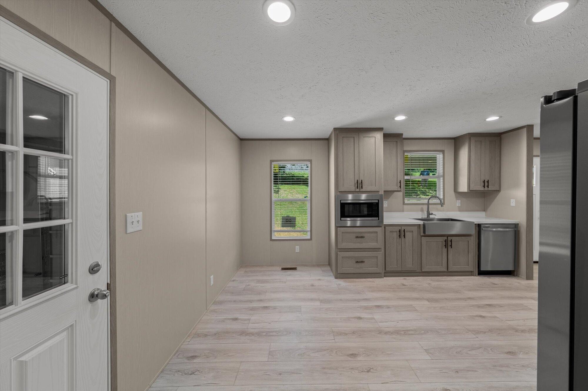 612 Caldwell Road Loudon, TN 37774 - Photo 7 of 16 a kitchen with stainless steel appliances granite countertop a refrigerator and a stove top oven