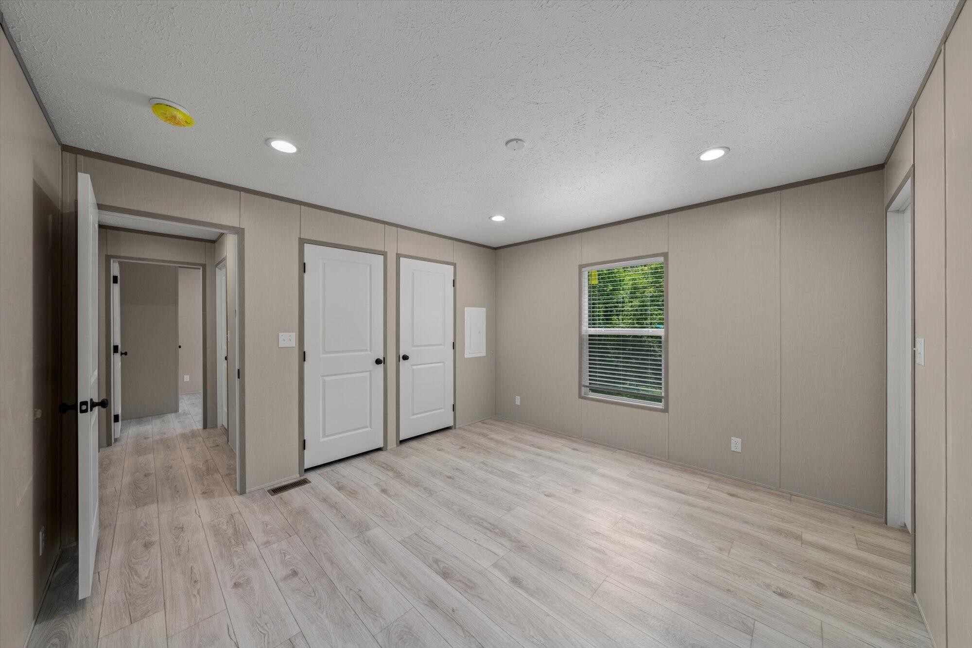 612 Caldwell Road Loudon, TN 37774 - Photo 9 of 16 a view of an empty room with wooden floor and a window