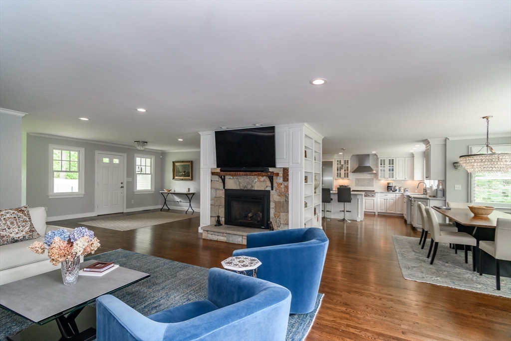 1098 Webster Street Needham, MA 02492 - Photo 6 of 21 a living room with fireplace furniture and a wooden floor
