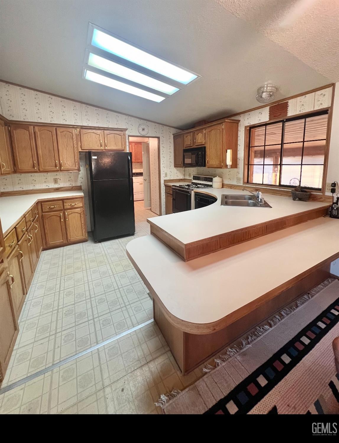 Undisclosed Address Caliente, CA 93518 - Photo 15 of 24 a living room with stainless steel appliances kitchen island granite countertop a sink refrigerator stove and a oven