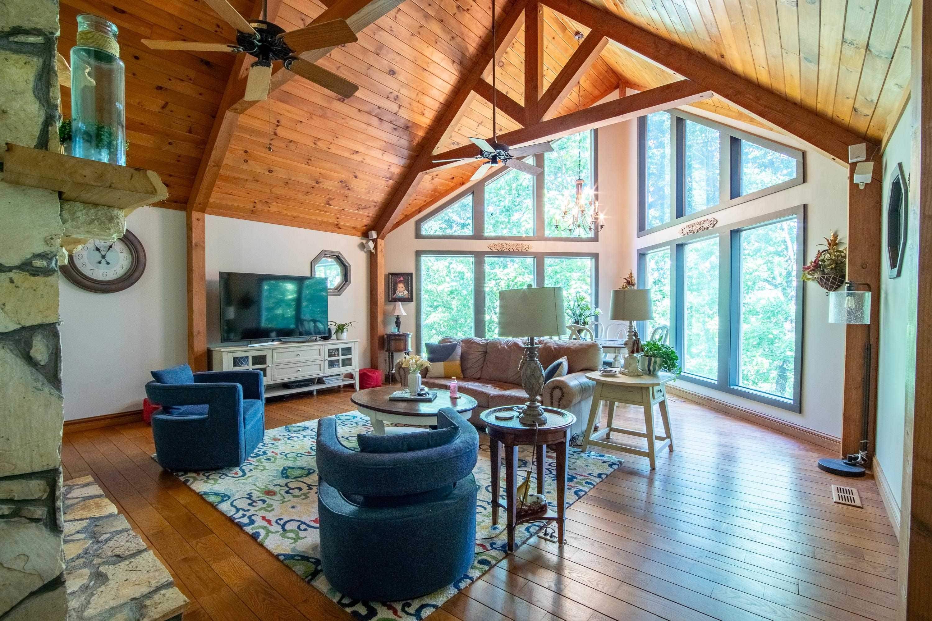 140 Ridge View Savannah, TN 38372 - Photo 22 of 36 a living room with fireplace furniture and a large window