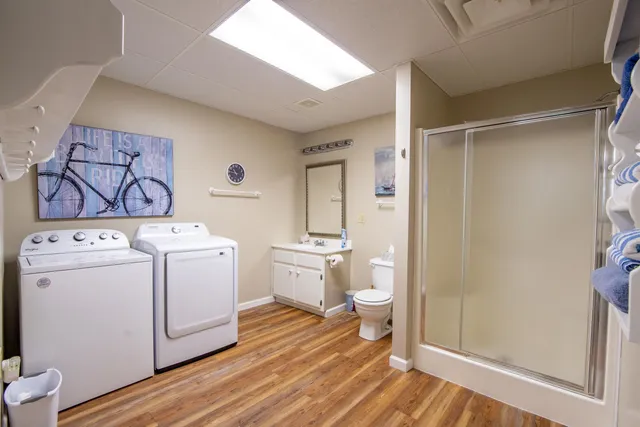 a view of bathroom with washer and dryer