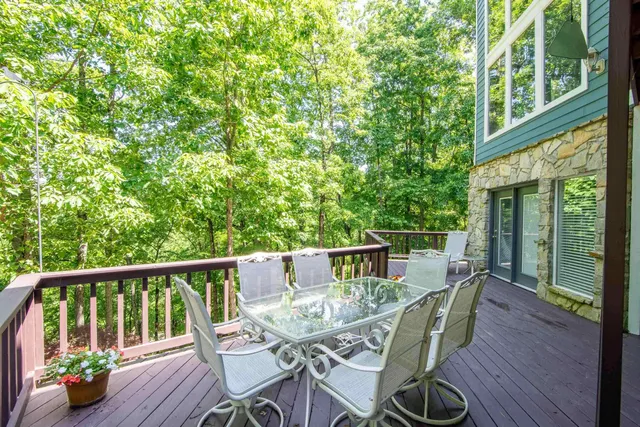a view of balcony with furniture and wooden deck