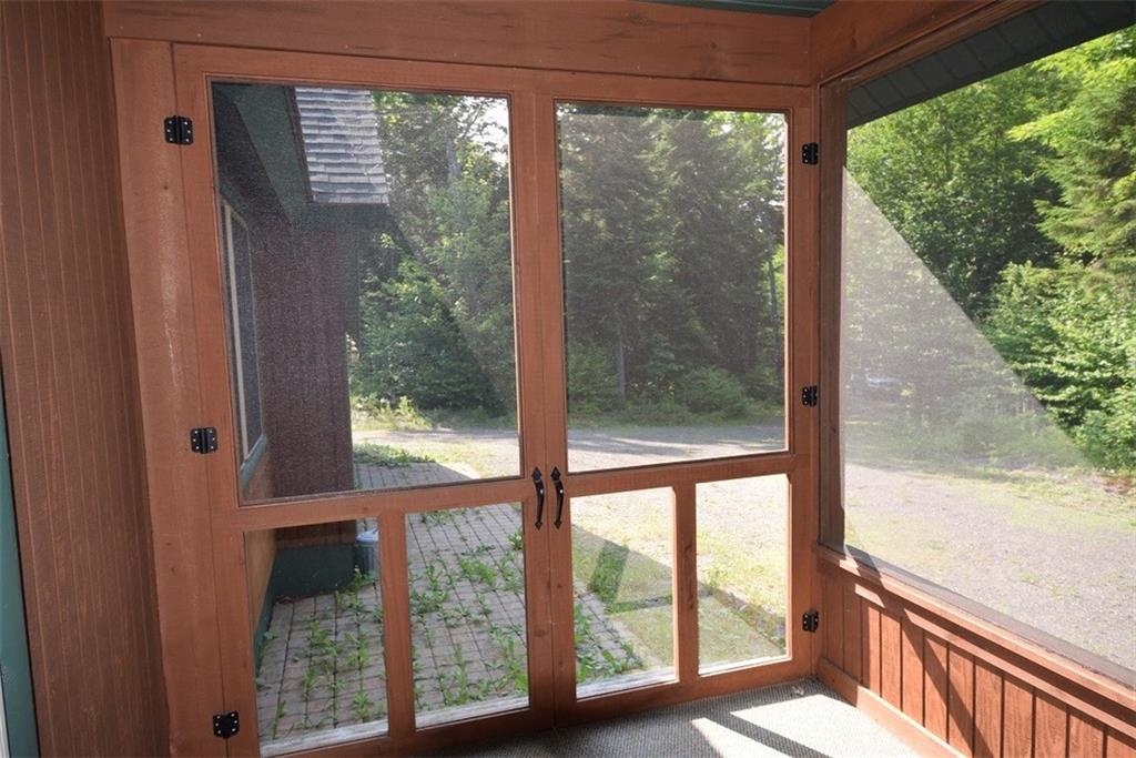 85 Gardner Point Road Mount Chase, ME 04765 - Photo 6 of 35 Double door screened porch, brick...