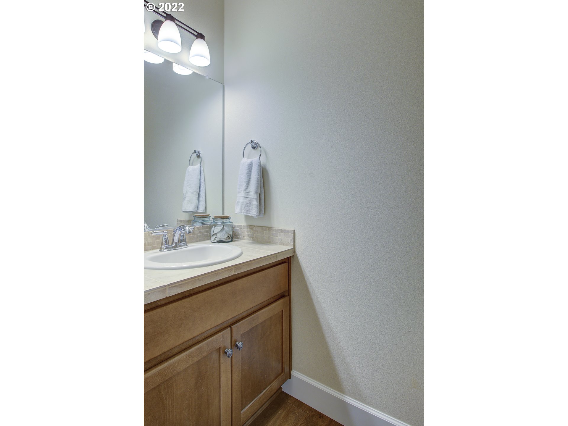 101 North 38th Place Ridgefield, WA 98642 - Photo 12 of 32 a bathroom with a sink and a mirror