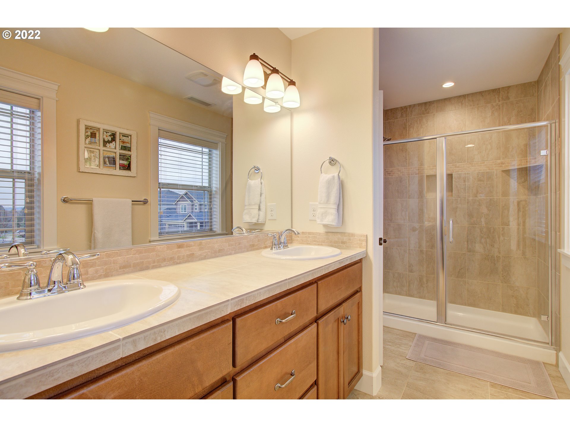 101 North 38th Place Ridgefield, WA 98642 - Photo 24 of 32 a bathroom with a sink double vanity and a mirror