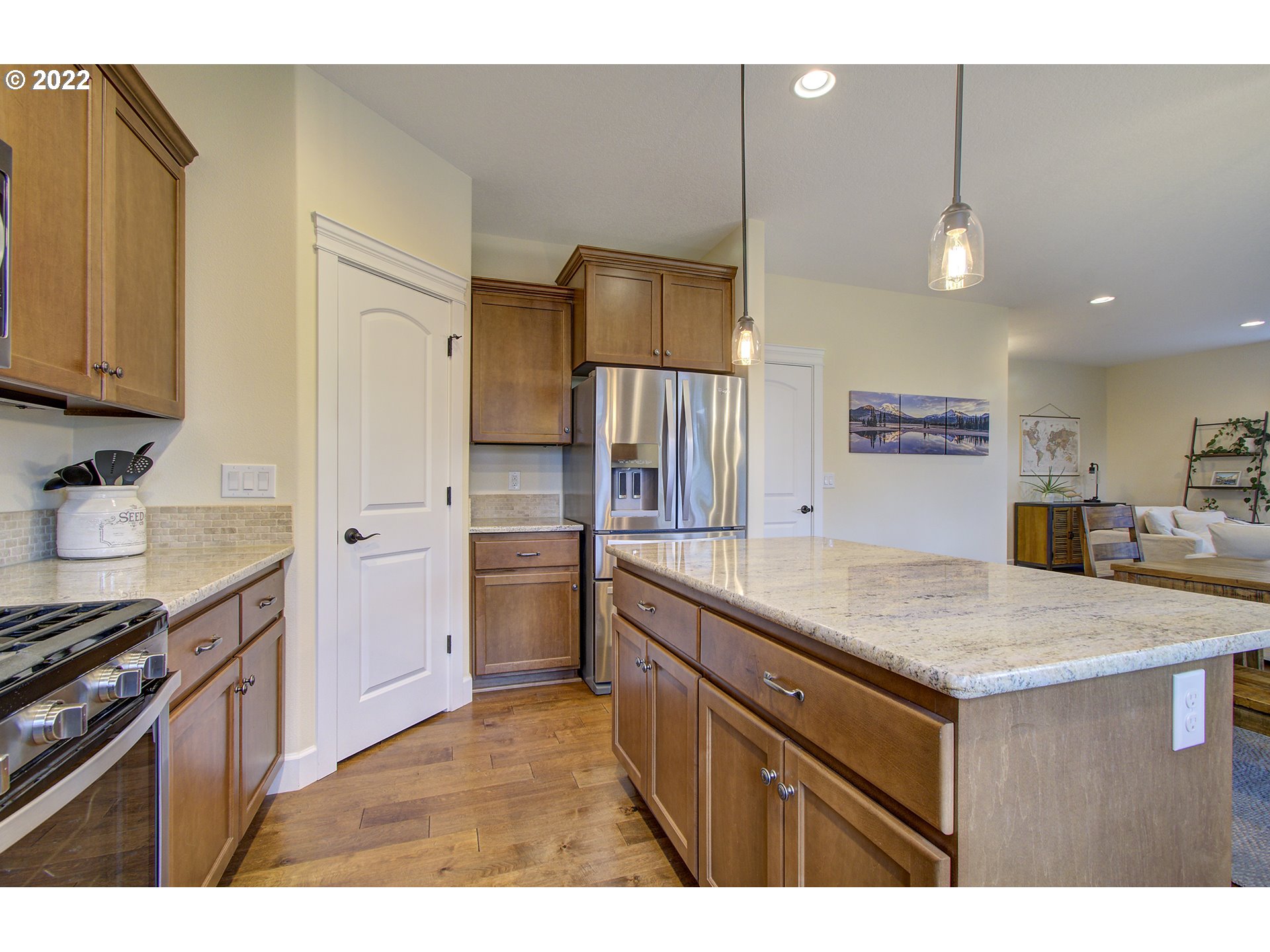 101 North 38th Place Ridgefield, WA 98642 - Photo 8 of 32 a kitchen with a counter space a sink a refrigerator and cabinets